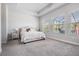 Large main bedroom features soft carpet, plenty of natural light and neutral colored walls at 16701 Vibrato Ln, Land O Lakes, FL 34638