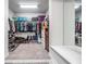 Large walk-in closet featuring carpet flooring and extensive shelving and storage solutions at 16701 Vibrato Ln, Land O Lakes, FL 34638