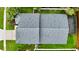 Aerial view of a house showing the roof, backyard, and surrounding greenery at 19830 Ellendale Dr, Land O Lakes, FL 34638
