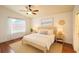 Inviting main bedroom with hardwood floors, natural light, and a ceiling fan at 19830 Ellendale Dr, Land O Lakes, FL 34638