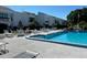 Refreshing community pool with ample lounge chairs and patio tables at 2060 Marilyn St # 124, Clearwater, FL 33765