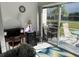Bright sunroom with patio access, featuring comfortable seating and a workspace at 2060 Marilyn St # 124, Clearwater, FL 33765