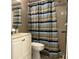 Bright bathroom with shower/tub combo, toilet and vanity at 2060 Marilyn St # 124, Clearwater, FL 33765