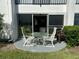 Private patio with table and chairs, perfect for relaxing at 2060 Marilyn St # 124, Clearwater, FL 33765
