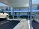 Covered parking with assigned space near building entrance at 2060 Marilyn St # 124, Clearwater, FL 33765