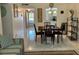 Spacious living room with seating area and view into dining area at 2060 Marilyn St # 124, Clearwater, FL 33765