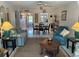 Spacious living room with seating area and view into dining area at 2060 Marilyn St # 124, Clearwater, FL 33765