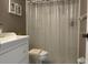 Bright bathroom featuring a shower, toilet and white vanity at 2060 Marilyn St # 124, Clearwater, FL 33765