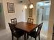 View of dining area with kitchen access, showing a table with four chairs at 2060 Marilyn St # 124, Clearwater, FL 33765