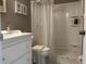 Clean bathroom with white vanity, shower, and a clear shower curtain at 2060 Marilyn St # 124, Clearwater, FL 33765