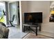 Relaxing living room with TV and access to a patio at 2060 Marilyn St # 124, Clearwater, FL 33765