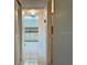 Hallway with view of kitchen and bathroom at 2060 Marilyn St # 124, Clearwater, FL 33765