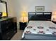 Bedroom with double bed, dresser, and nightstand at 2060 Marilyn St # 124, Clearwater, FL 33765