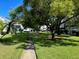 Landscaped courtyard with walking path and lush greenery at 2060 Marilyn St # 124, Clearwater, FL 33765