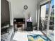 Bright sunroom with patio access, featuring comfortable seating and a workspace at 2060 Marilyn St # 124, Clearwater, FL 33765