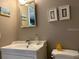 Clean bathroom with single sink vanity, toilet, and shower at 2060 Marilyn St # 124, Clearwater, FL 33765