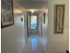 Bright hallway with tiled floors and framed art at 2060 Marilyn St # 124, Clearwater, FL 33765
