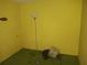 Unfinished basement room with floor lamp and old TV at 3754 Lake Joyce Dr, Land O Lakes, FL 34639