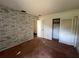 Bedroom with brick accent wall and closet at 3754 Lake Joyce Dr, Land O Lakes, FL 34639