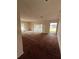 Spacious living room with large windows and lake view at 3754 Lake Joyce Dr, Land O Lakes, FL 34639