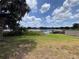 Scenic view of lake with lush greenery and blue sky at 3754 Lake Joyce Dr, Land O Lakes, FL 34639