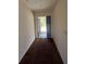 Hallway with an open door leading to the backyard at 3754 Lake Joyce Dr, Land O Lakes, FL 34639