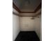 Walk-in closet with hanging rods and carpeted floor at 3754 Lake Joyce Dr, Land O Lakes, FL 34639