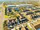 A bird's-eye view of a neighborhood with cozy townhomes, lush landscaping, and a community pool at 10254 Red Currant Ct, Riverview, FL 33578