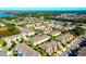 Expansive aerial view showcasing the community's layout with lakes, green spaces, and well-maintained townhome clusters at 10254 Red Currant Ct, Riverview, FL 33578