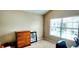 Bedroom space with a large window providing plenty of natural light and a neutral decor at 10254 Red Currant Ct, Riverview, FL 33578