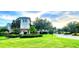 Attractive Ventura Bay community entrance with manicured landscaping and welcoming architectural details at 10254 Red Currant Ct, Riverview, FL 33578