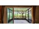 Cozy screened lanai featuring views of well-maintained landscaping, providing a serene outdoor living space at 10254 Red Currant Ct, Riverview, FL 33578