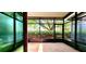 Enclosed patio with view of mature trees and landscaping providing privacy and shade at 10254 Red Currant Ct, Riverview, FL 33578