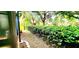 Well-manicured yard featuring lush greenery and neatly trimmed hedges, creating a picturesque outdoor space at 10254 Red Currant Ct, Riverview, FL 33578