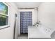 Laundry room with washer, dryer, and shower at 1006 E Fern St, Tampa, FL 33604