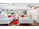 Two twin beds, a ceiling fan, and nautical decor at 1006 E Fern St, Tampa, FL 33604
