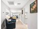 Inviting hallway with two armchairs and view into living room at 1006 E Fern St, Tampa, FL 33604