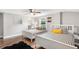 Two twin beds, ceiling fan, and wood floors at 1006 E Fern St, Tampa, FL 33604