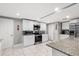Well-equipped kitchen with white cabinets and stainless steel appliances at 1006 E Fern St, Tampa, FL 33604