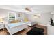 Two twin beds, ceiling fan, and wood floors at 1006 E Fern St, Tampa, FL 33604