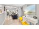 Light and airy hallway with modern decor and view to living area at 1006 E Fern St, Tampa, FL 33604