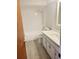 Updated bathroom with white subway tile and quartz vanity at 318 Windrush Blvd # 9, Indian Rocks Beach, FL 33785