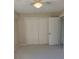 Bright bedroom with ample closet space and neutral carpeting at 318 Windrush Blvd # 9, Indian Rocks Beach, FL 33785