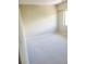 Carpeted bedroom with neutral walls at 318 Windrush Blvd # 9, Indian Rocks Beach, FL 33785