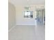 Bright dining area with tile floors and kitchen pass-through at 318 Windrush Blvd # 9, Indian Rocks Beach, FL 33785