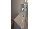 Bathroom with quartz vanity and large mirror at 318 Windrush Blvd # 9, Indian Rocks Beach, FL 33785