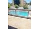 Community pool view from private balcony at 318 Windrush Blvd # 9, Indian Rocks Beach, FL 33785
