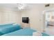 Bedroom with two double beds, TV, and access to another bedroom at 19610 Gulf Blvd # 409, Indian Shores, FL 33785