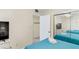 Bedroom with two double beds, TV, and access to hallway at 19610 Gulf Blvd # 409, Indian Shores, FL 33785