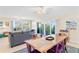 Bright living room with comfortable seating and dining area at 19610 Gulf Blvd # 409, Indian Shores, FL 33785